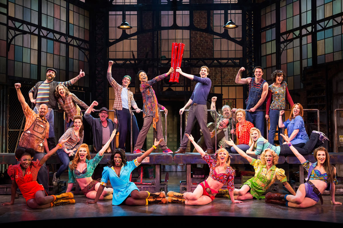 The cast of Kinky Boots cheers on the factory set, ensemble and drag performers together, Broadway 2013