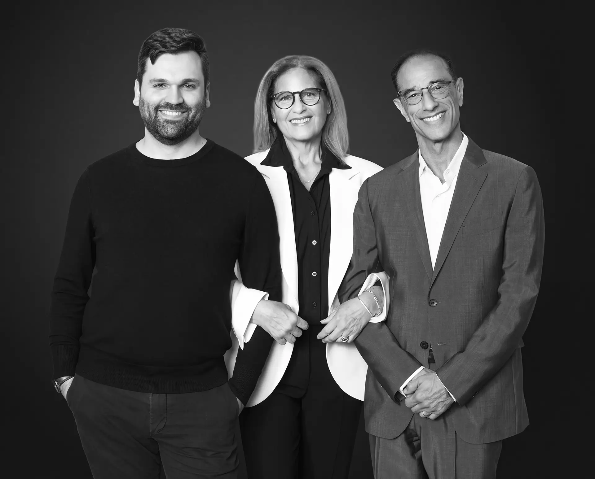 Black-and-white photograph of the three Halcyon partners, Kevin Connor, Cathy Dantchik, Hal Luftig